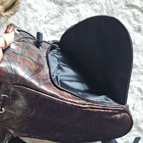 Elegant Brown Leather Backpack with Embossed Design - Picture 11 of 14